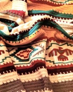 the blanket is crocheted with different colors