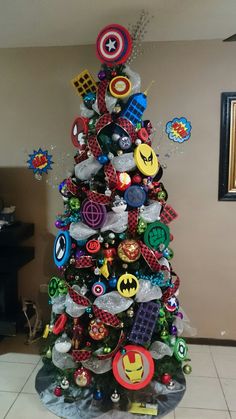 a christmas tree decorated with many different types of buttons and magnets on it's top