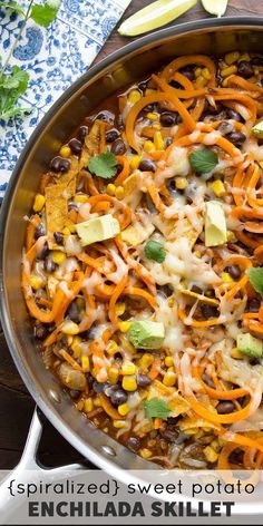 an enchilada skillet with black beans, corn and avocado