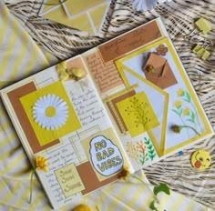 an open scrapbook with yellow and white paper