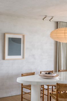 a white table and chairs in a room