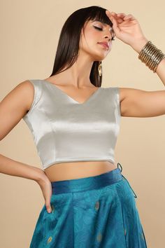 Item Type: Saree blouse / Crop top Product Features: Color: Silver Fabric: Cotton Satin Stretch Blend Trim: Back Tie Neck Style: V-Neck, Front & Back Sleeve Length: Sleeveless Closure: Back Hook Padded: No Disclaimer: There will be slight difference in digital to actual image Fitted V-neck Vest Crop Top, Summer V-neck Padded Crop Top, Padded V-neck Tank Top, Summer V-neck Padded Blouse, Fitted V-neck Padded Blouse Crop Top, Fitted V-neck Crop Top With Padded Blouse, Fitted V-neck Padded Crop Top, Summer V-neck Blouse Piece, Fitted V-neck Crop Top With Padding