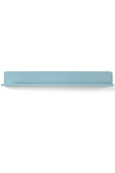 a blue shelf sitting on top of a white wall in front of a white background