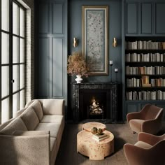 a living room filled with furniture and a fire place in front of a book shelf