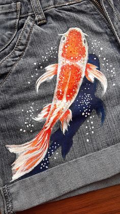 One more fish on my shorts Jeans Drawing Ideas, Painted Clothes Diy Jeans, Koi Fish Outfit, Bleach Art Jeans, Artsy Jeans, Painting On Jeans, Fish Clothes, Painting Jeans, Jeans Drawing