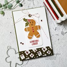 a card with a ginger on it next to some crayon pencils and scissors