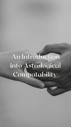 two hands holding each other with the words, an instruction into astrological compatability