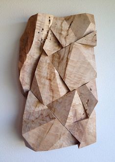 a piece of wood that has been cut into smaller pieces and placed on the wall