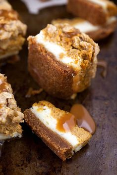 several pieces of dessert sitting on top of a wooden table