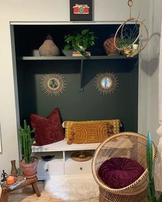 a living room filled with lots of furniture and plants on top of the shelves in front of them