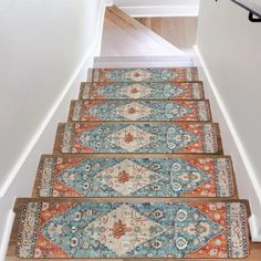 a set of stairs with rugs on them