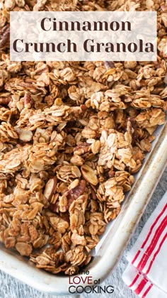 homemade cinnamon crunch granola in a white baking dish on a blue towel with text overlay