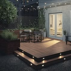 an outdoor deck with lights on it and some plants in the back ground next to it