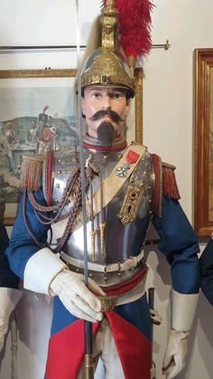 a statue of a man in uniform with a mustache