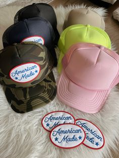 Camo, khaki, navy, light pink, or neon yellow high crown foam snap back trucker hat detailed with American Made patch Trucker Snapback Hat With Patches For Streetwear, Trucker Style Snapback Hat With Patches For Streetwear, Trucker Style Snapback Baseball Cap With Patches, Trucker Style Baseball Cap With Patches, Trucker Hat With Patches For Streetwear, Adjustable Snapback Trucker Hat With Patches, Streetwear Trucker Hat With Patches, Patched Snapback Trucker Hat, Adjustable Baseball Cap With Patches For Streetwear