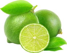 two limes with green leaves and one cut in half