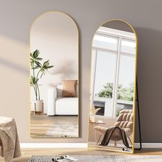 a living room with two mirrors on the wall