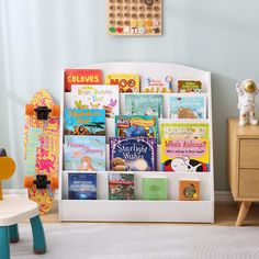 a child's bookshelf filled with children's books in a room