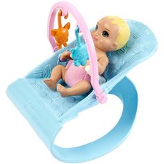 a baby doll sitting in a toy pool with a cat on it's back