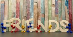 the word friends spelled out in wooden letters