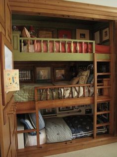 a wooden bunk bed with lots of drawers