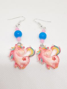 These magical unicorn earrings are made with resin charms and silver tone materials.  Be sure to check out my items too! Clay Unicorn Earrings, Pink Resin Kawaii Earrings, Unicorn Earrings, Unicorn Charm, Unicorn Pendant, Fun Jewelry, Magical Unicorn, Resin Charms, Amazing Jewelry