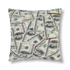 a pillow that has money on it