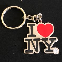 i love new york keychain with heart and letters on black fabric back ground