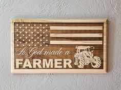 a wooden sign with an american flag and tractor