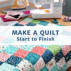 a sewing machine sitting on top of a wooden table next to a quilted blanket