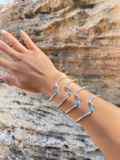 Catch the wave with this unique sterling silver twist with a hint of turquoise. This is so fun and simple, it'll get all the eyes staring! Embr Wave Bracelet, Ocean Wave Jewelry, Waves Jewelry, Wave Inspired Jewellery, Turquoise Ocean-inspired Sterling Silver Jewelry, Eyes Staring, Wave Bracelet, The Wave, Cuff Bracelets