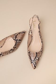 From the office halls to happy hour fun, the Lulus Fosette Brown Snake Pointed-Toe Slingback Pumps are ready to strut through it all! These ultra-chic pumps have a snake-embossed, faux leather construction that shapes a pointed-toe upper and a low-cut collar that flows into a classic slingback strap with a little gold buckle. Flirty kitten-style heel completes the versatile look! 2" wrapped spool heel. Cushioned insole. Rubber sole has nonskid markings. Man made materials. Imported. Lulus | Fose Homecoming Shoes, Brown Snake, Kitten Heel Shoes, Pattern Shoes, Spool Heel, Shoes Heels Pumps, Slingback Pump, Work Shoes, Pump Shoes