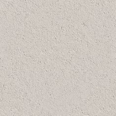 a white stucco wall textured with cement