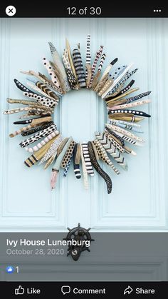 an image of a wreath made out of toothbrushes on the front door frame