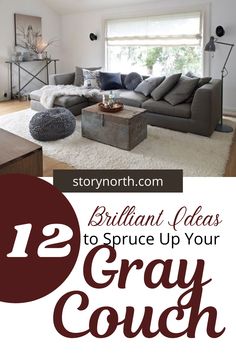 a living room with gray couches and white rugs