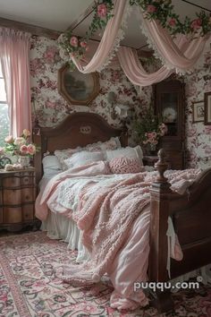 a bedroom decorated in pink and white with floral wallpaper on the walls, an antique wooden bed frame