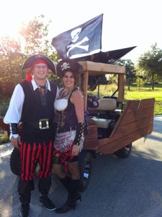 a man and woman dressed up in pirate costumes