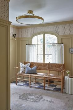 a living room filled with furniture and a large window