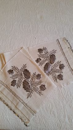 two pieces of cloth with designs on them