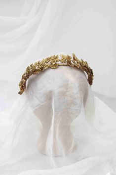 "This golden Greek goddess inspired headpiece looks lovely worn at weddings, anniversaries, events, or simply as a fashion piece. Features: - Each leaf is individually hand wired and sculpted from clay - Gilded and Sealed with a glossy finish for durability - Light weight to wear comfortably - Band has small loops at each end to have the option to add your own ribbon to tie back, Pin or leave as is Approximate Measurements: Wire band length 14\" 1\" width ---------------------------------------- Golden Headband, Grecian Headpiece, Bridal Hair Pieces Boho, Gold Leaf Crown, Vine Headband, Leaf Crown, Flower Tiara, Crown Gold, Gold Headpiece