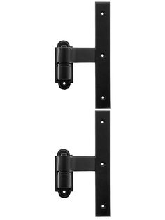 two black wall mounted brackets on a white background and one is holding the door handle