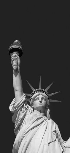 the statue of liberty is shown in black and white