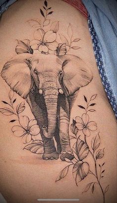 an elephant with flowers on its back