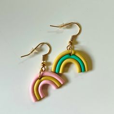 THE BASICS: - hypoallergenic - nickel-free - 18k gold plated ear wire, 24k gold plated jump rings - made of polymer clay - shape: rainbow - colors: bright yellow ochre, minty green, pale pink - ear wire Minty Green, Yellow Ochre, Earrings Polymer Clay, Rainbow Earrings, Bright Yellow, Ear Wire, Jump Rings, Pale Pink, Clay Earrings