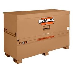 a large box sitting on top of a pallet with the words knaack written on it