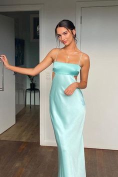 Featuring a sheath silhouette and full length, this maxi dress is crafted with a trendy cowl back and cutouts on both sides. Made with satin material in a refreshing aqua color, it is accented with delicate spaghetti straps for a modern and chic look. SKU: 3897 Aqua color Satin material Sheath silhouette Spaghetti straps Cutous both sides Cowl back Full length Wedding Guest Dresses Long, Cutout Maxi Dress, Long Evening Gowns, Pretty Prom Dresses, Grad Dresses, Looks Chic, Hoco Dresses