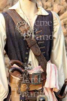 a mannequin dressed in pirate clothing with an iron - plated belt and hat