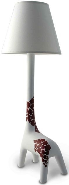 a giraffe lamp with a white shade on it's head and neck