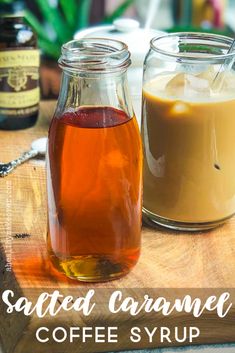 two jars filled with liquid sitting on top of a wooden cutting board