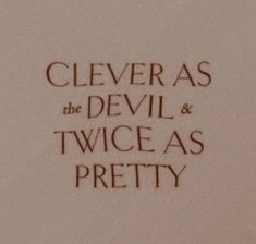 closeup of the back of a paper with writing on it that says clever as the devil and twice as pretty